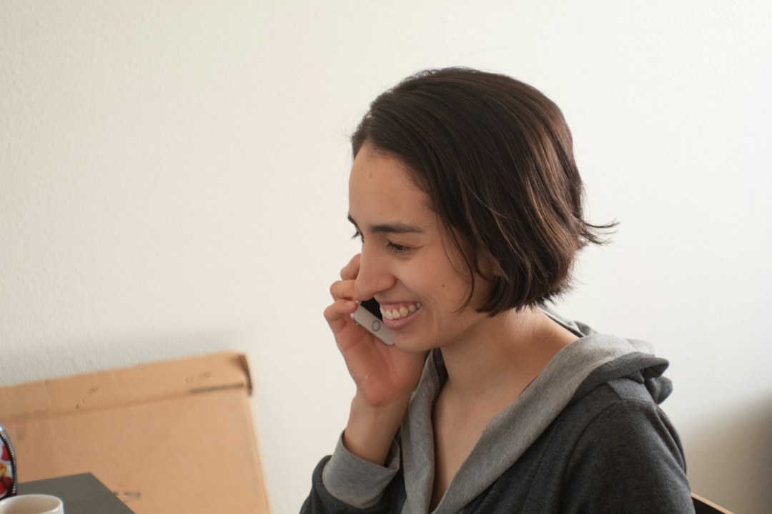 Person talking on phone at home